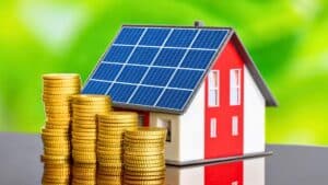 energy efficient home michigan tiny house with solar panel next to stacks of coins