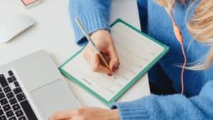 woman planning a trip or activity at laptop